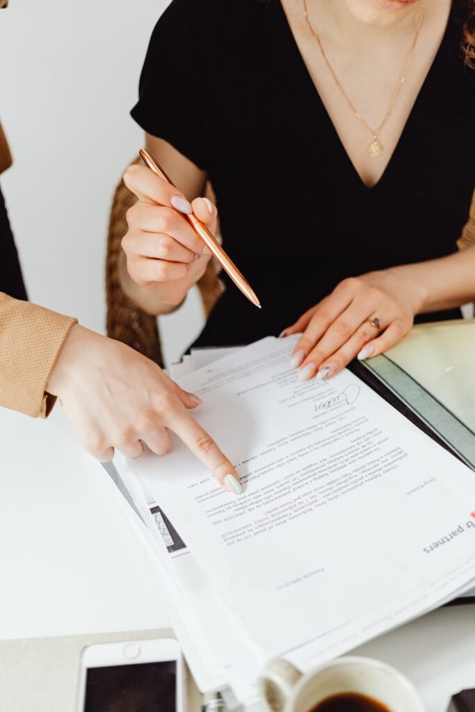 Two business professionals reviewing documents together.